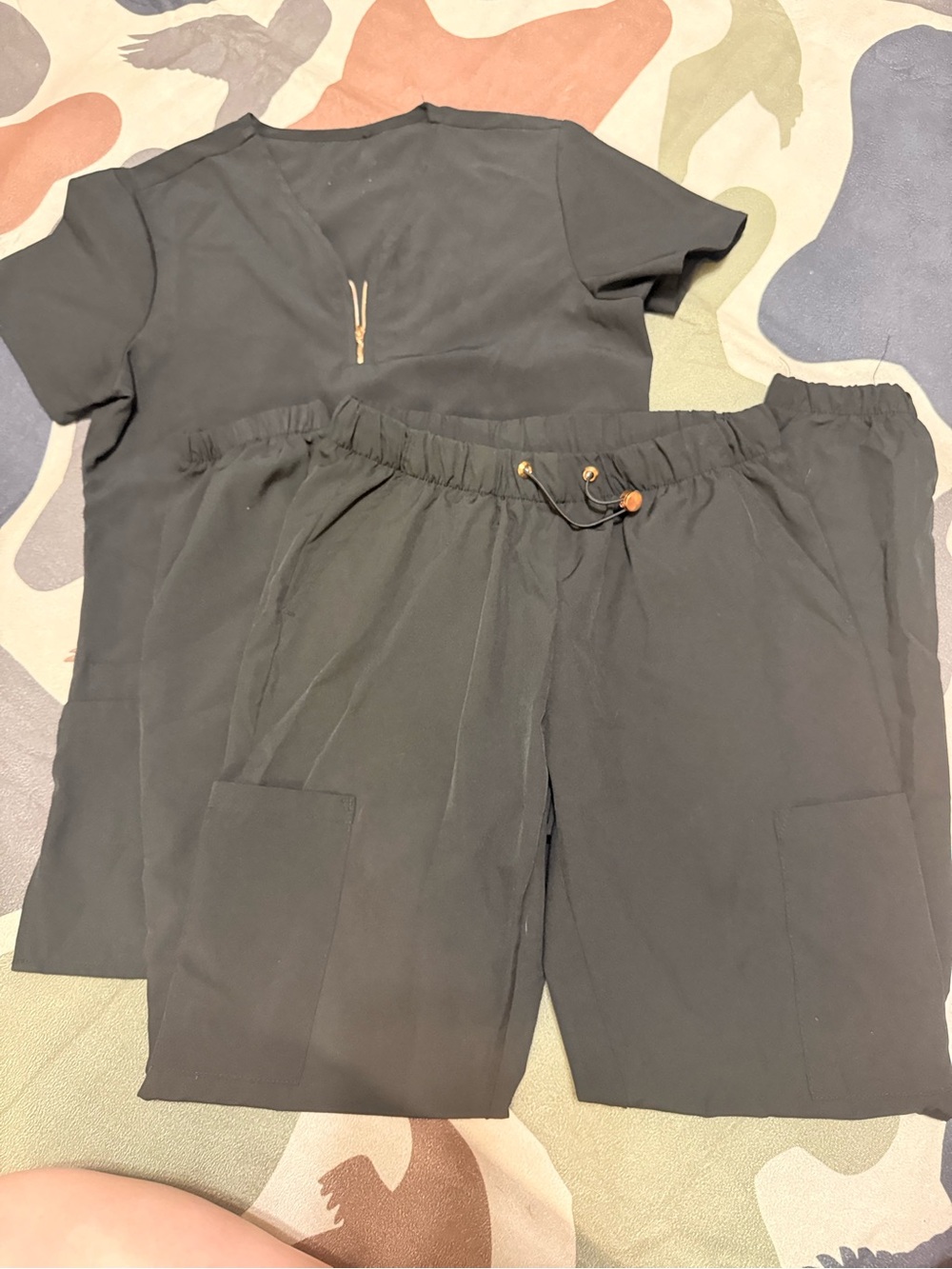 Black scrub set with rose gold details